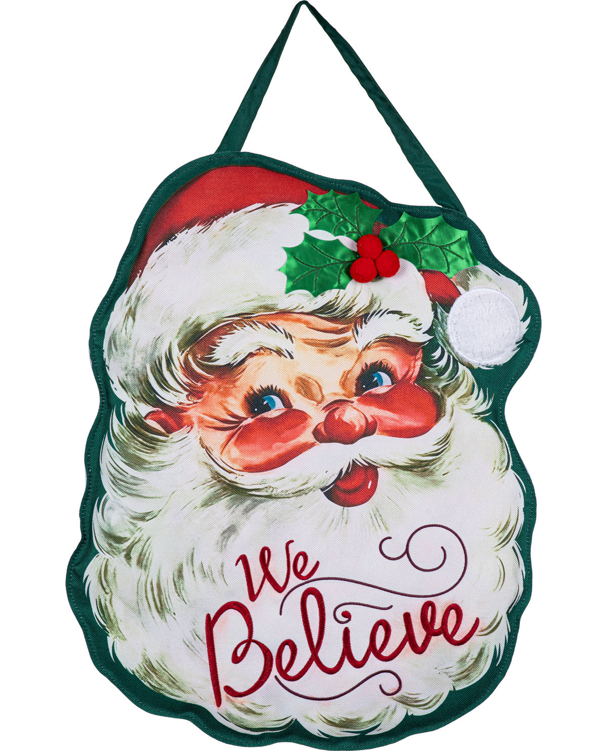 A vintage-style Christmas hanging ornament or plaque featuring a close-up illustration of Santa Claus's face with the words 'We Believe' in red script, a green border, and a hanging loop at the top.