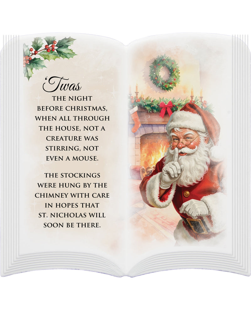 Open book with Christmas-themed illustration of Santa Claus and text on a white background