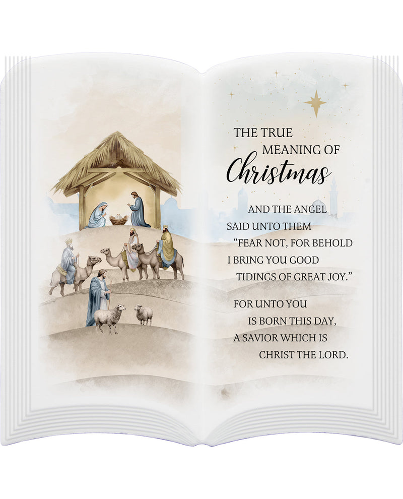 Open book with nativity scene illustration and Christmas text on a white background