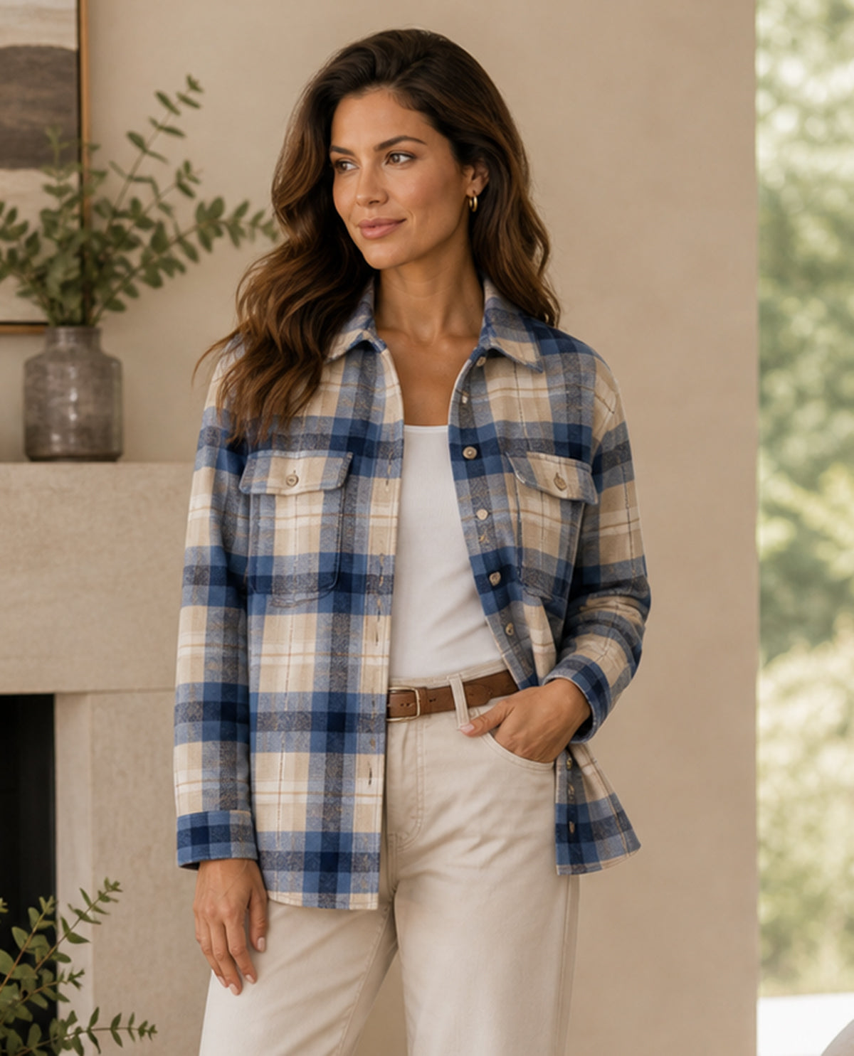 Woman wearing a plaid shirt in a home setting