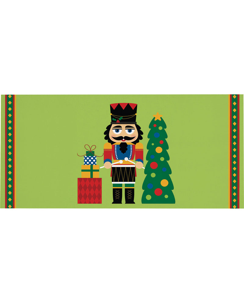 A festive Christmas-themed graphic featuring a nutcracker soldier holding a drum, standing next to a decorated Christmas tree and a wrapped gift box, set on a light green background with patterned borders.
