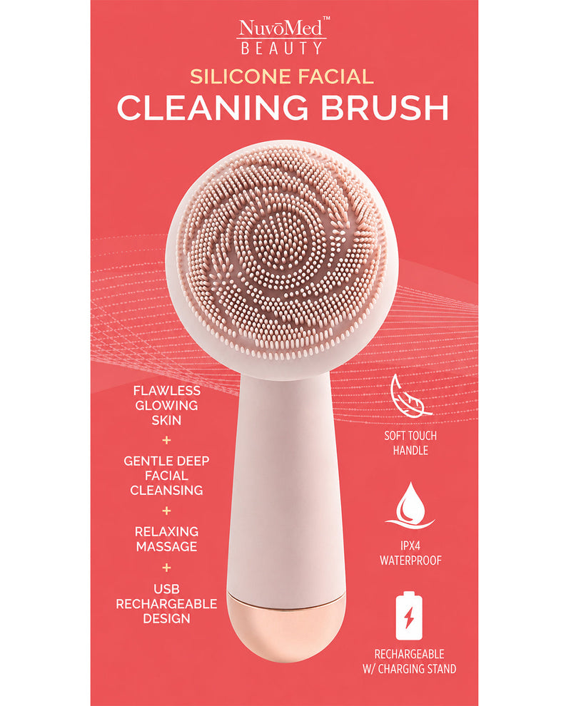 Silicone facial cleaning brush with NuvoMed Beauty branding on a red background