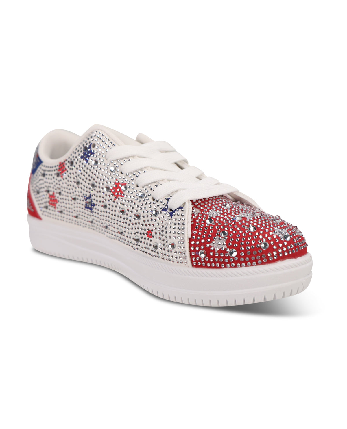 A low-top sneaker featuring a white upper covered in rhinestones with scattered red and blue star motifs, a red toe cap section embellished with silver rhinestones, white laces, and a white sole.