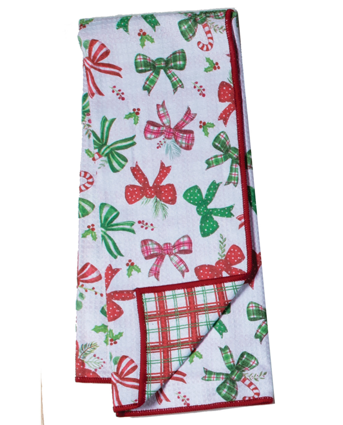 Christmas-themed kitchen towel with red and green bows on a white background