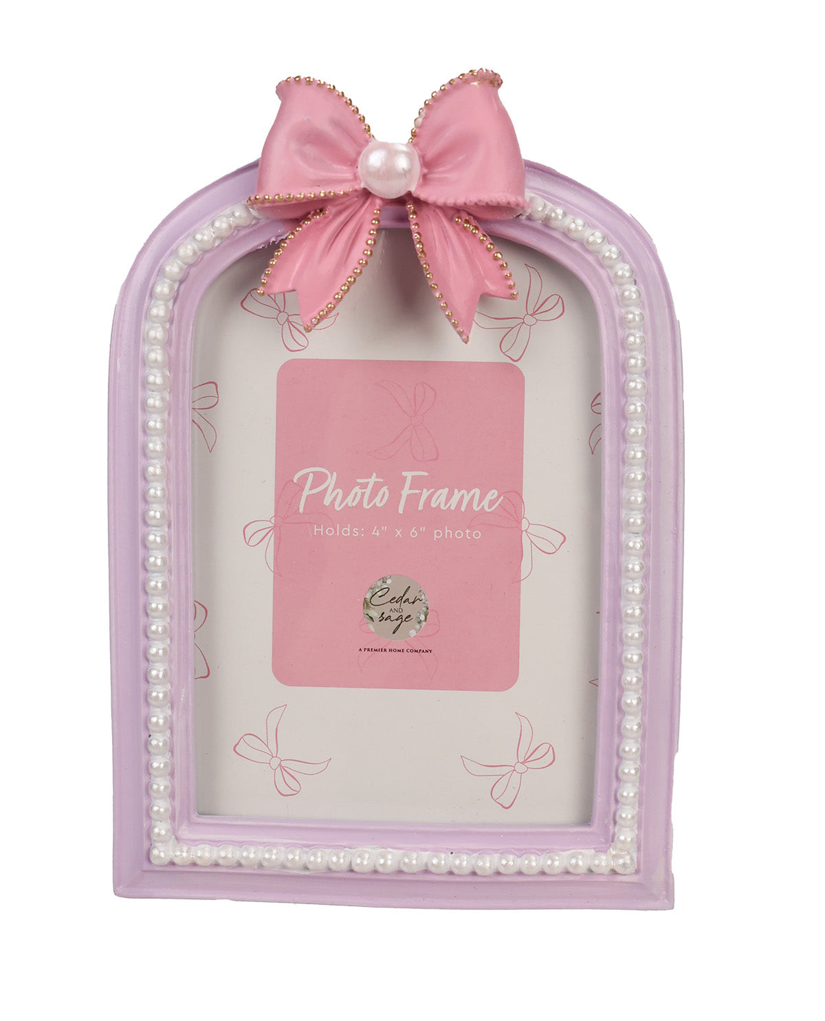 A light purple arched photo frame decorated with a large pink satin bow with a pearl center and gold trim, surrounded by a border of faux pearls. A pink placeholder card is visible inside the frame.