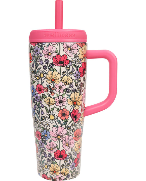 Floral-patterned tumbler with pink handle and lid on a white background