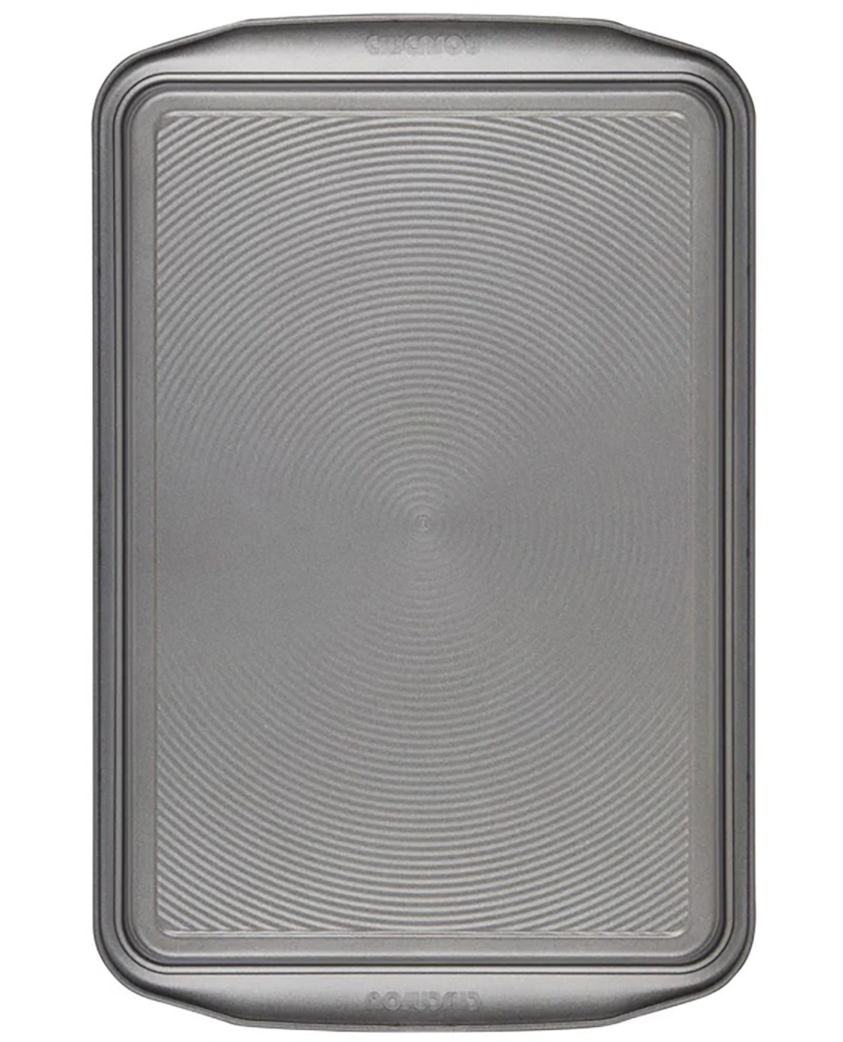 A rectangular metal baking pan with rounded corners and a textured, concentric-circle pattern on the bottom half, shown against a plain white background.