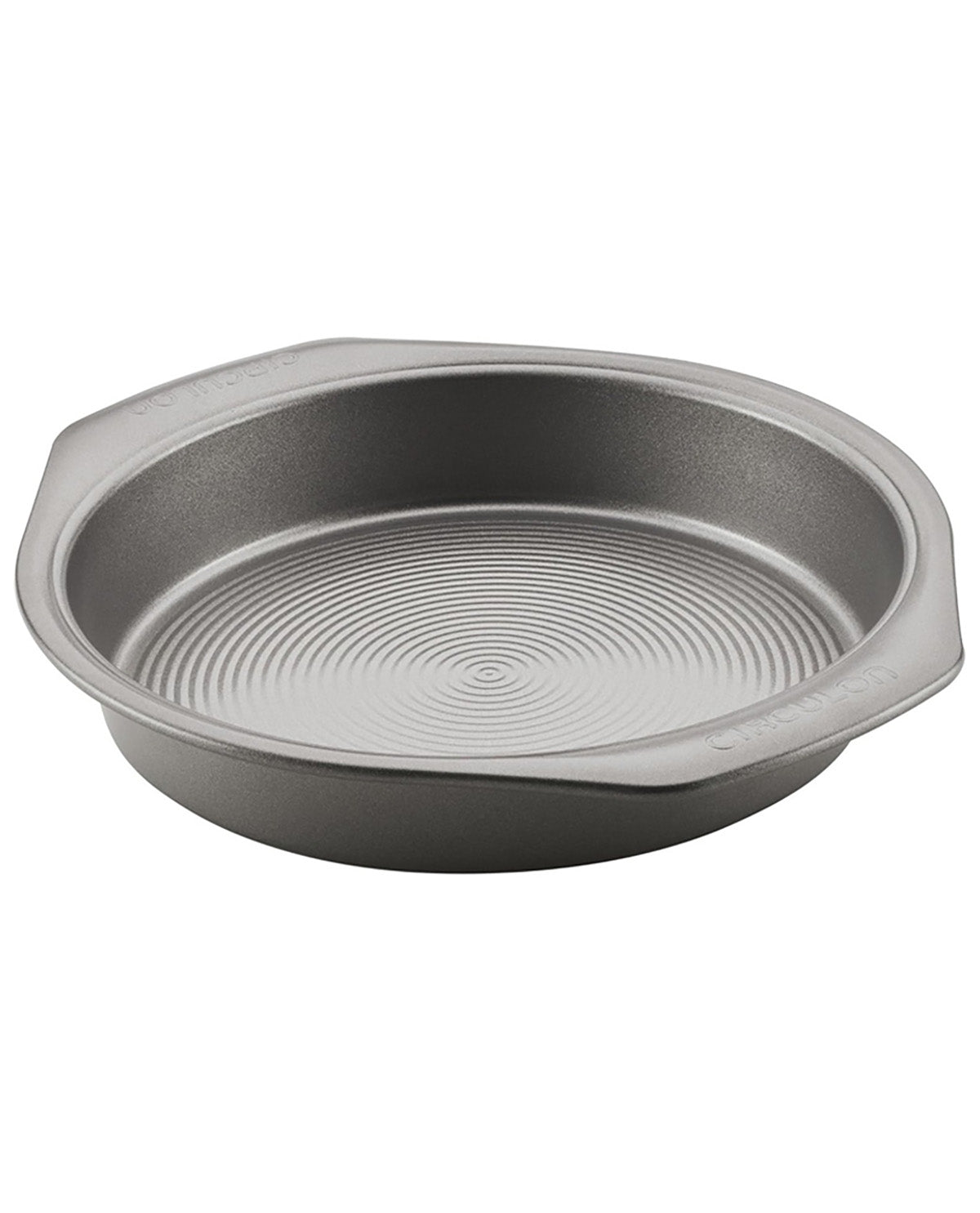 A round metal cake pan with a textured, ribbed interior and flared sides, shown on a plain white background.