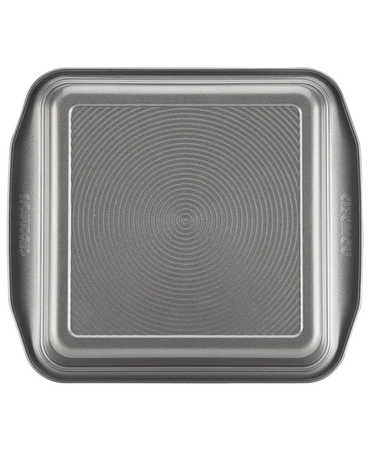 A square metal baking pan with rounded corners and a textured concentric circle pattern on the bottom, shown from a top-down view on a white background.