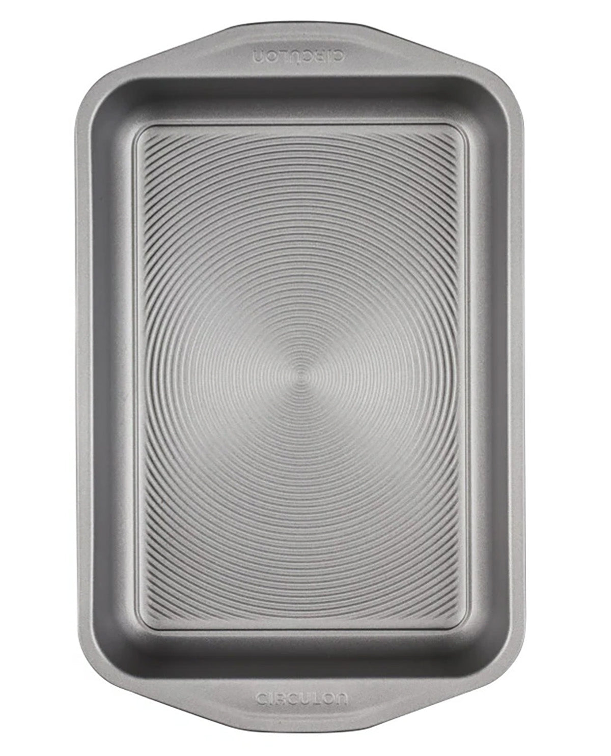 A rectangular metal baking pan with rounded corners and a textured circular pattern on the bottom, shown from a top-down view on a white background.