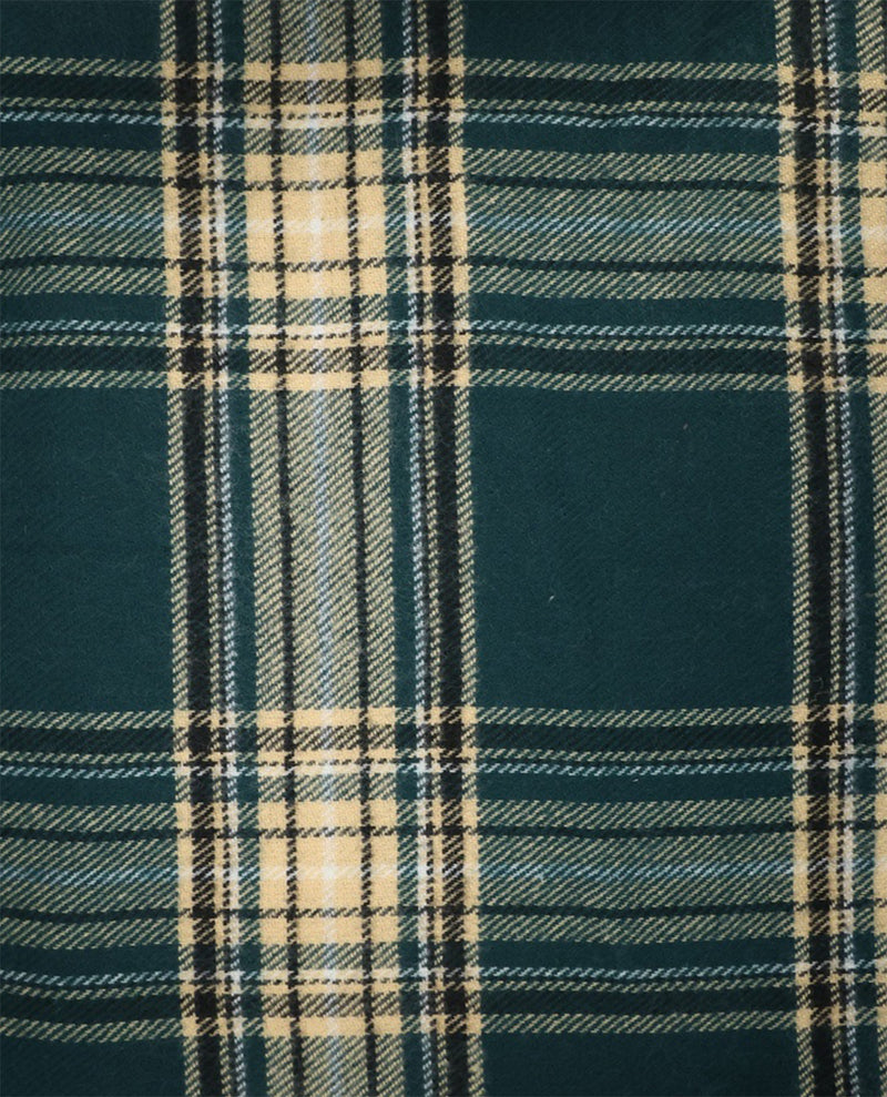 A close-up of a plaid fabric pattern with a dark teal-green base, cream stripes, and thin black lines.