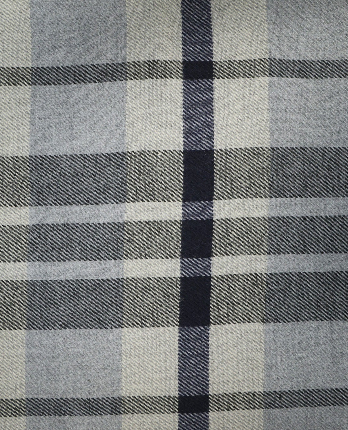 A close-up of a plaid fabric pattern with intersecting horizontal and vertical stripes in gray, off-white, and dark navy blue.