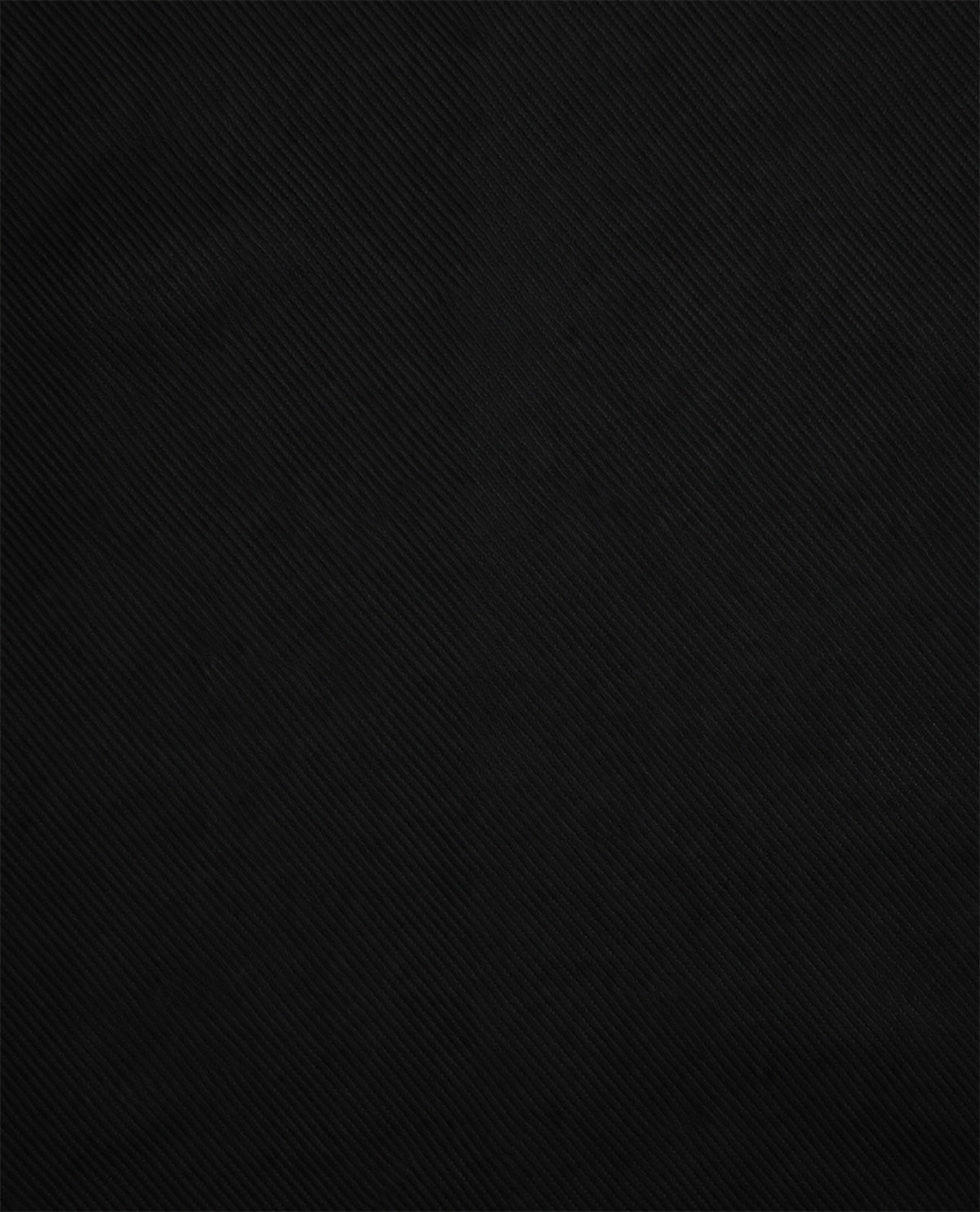 A close-up of a solid black textured fabric with a fine diagonal twill weave pattern.