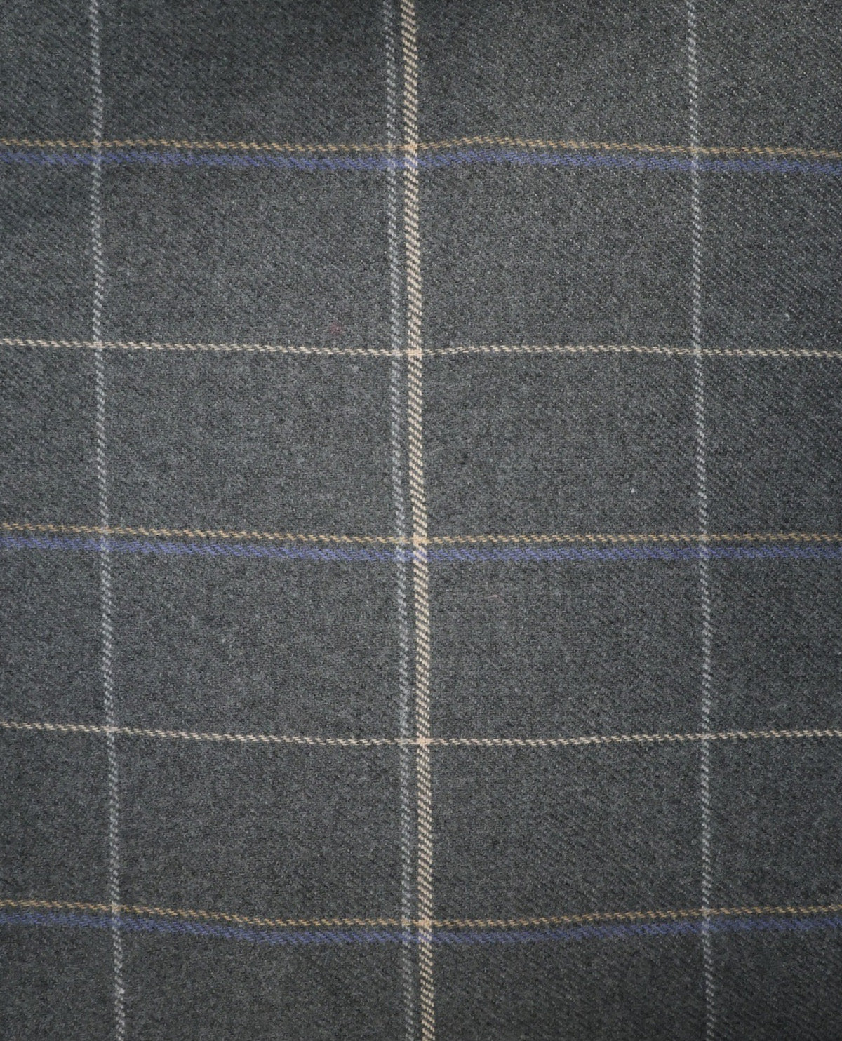 A close-up of dark gray plaid fabric with a windowpane pattern in beige and blue.