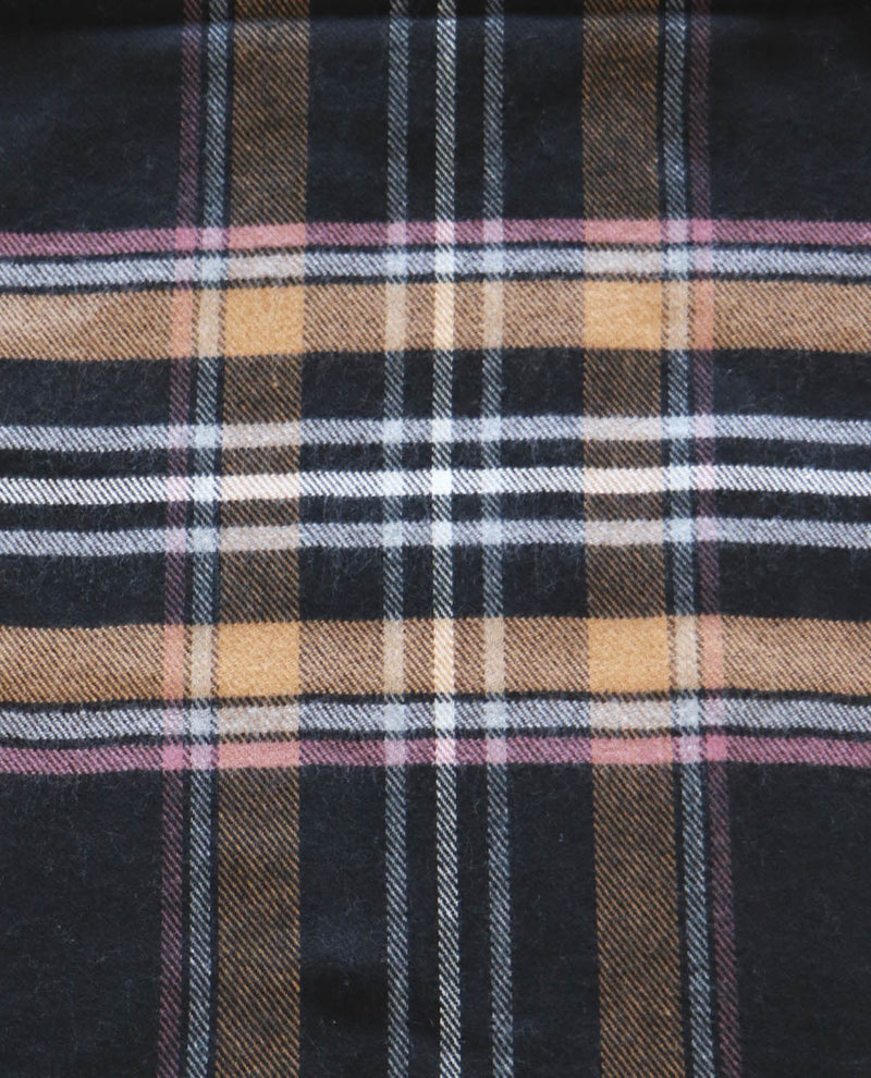 Close-up of plaid fabric with black, brown, and beige colors.
