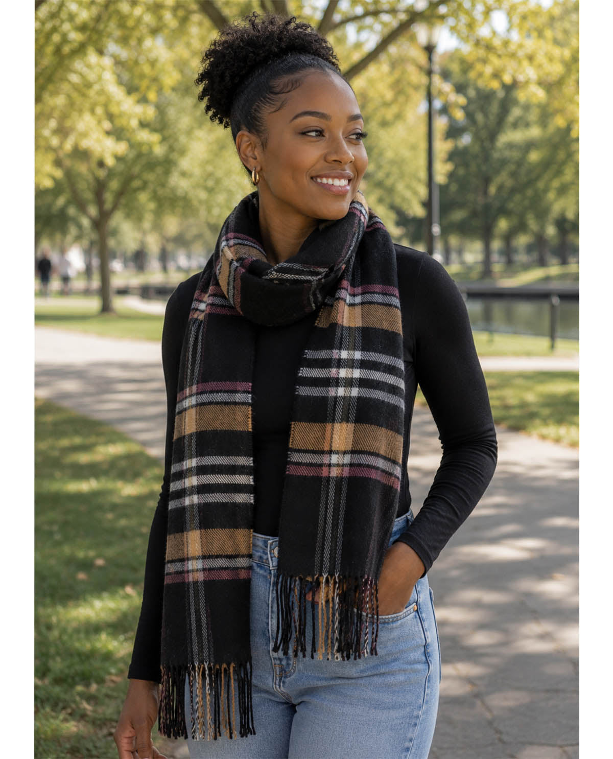 Woman wearing a plaid scarf in a park setting