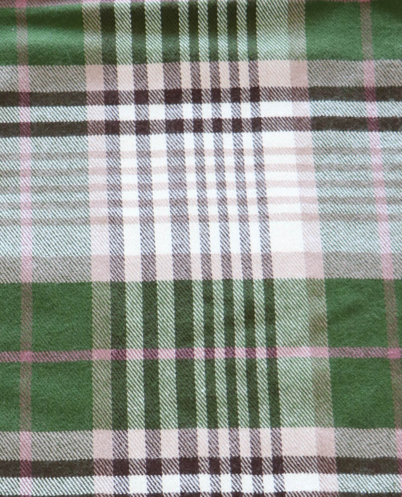 Close-up of green plaid fabric with a visible texture