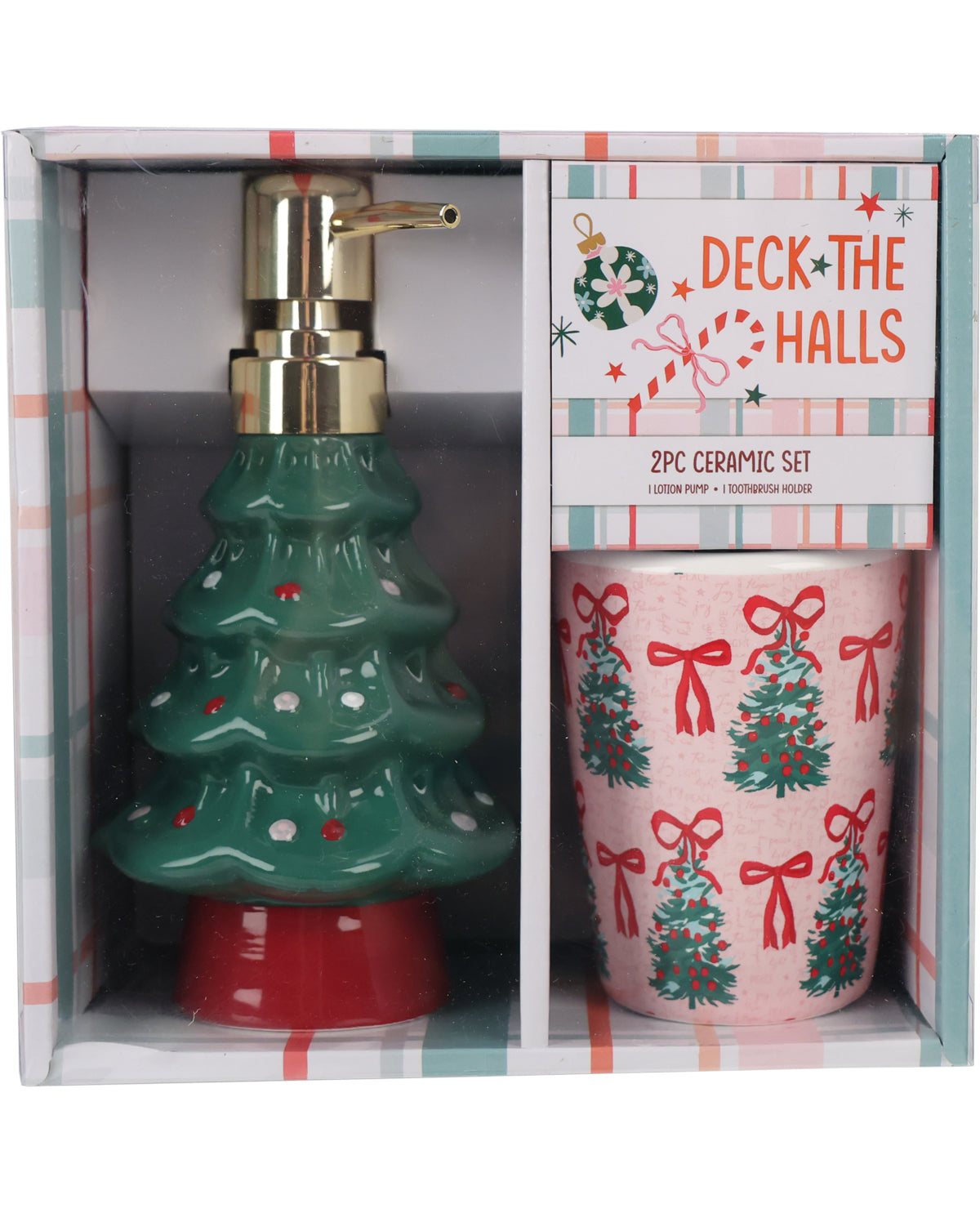 A 2-piece Christmas ceramic set in its original retail packaging, featuring a green tree-shaped soap dispenser with a gold pump and a pink mug decorated with red bows and green Christmas trees.