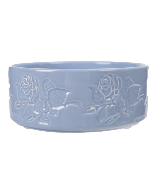 A light blue ceramic bowl featuring embossed rose and leaf patterns on its exterior, shown against a plain white background.