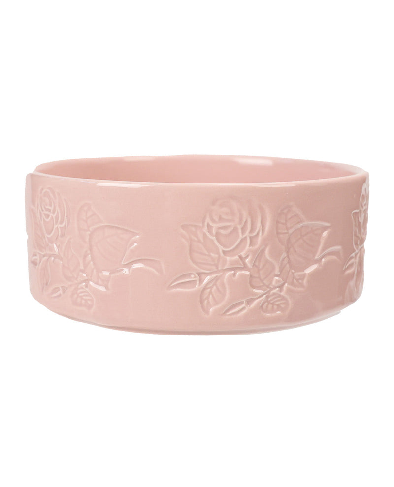 A wide, shallow pink ceramic bowl with embossed rose and leaf patterns on the exterior, shown against a plain white background.