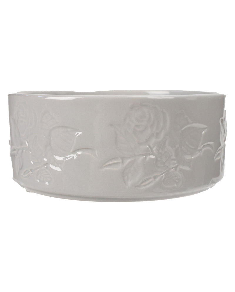 A white ceramic bowl with embossed floral rose patterns, shown against a plain white background.