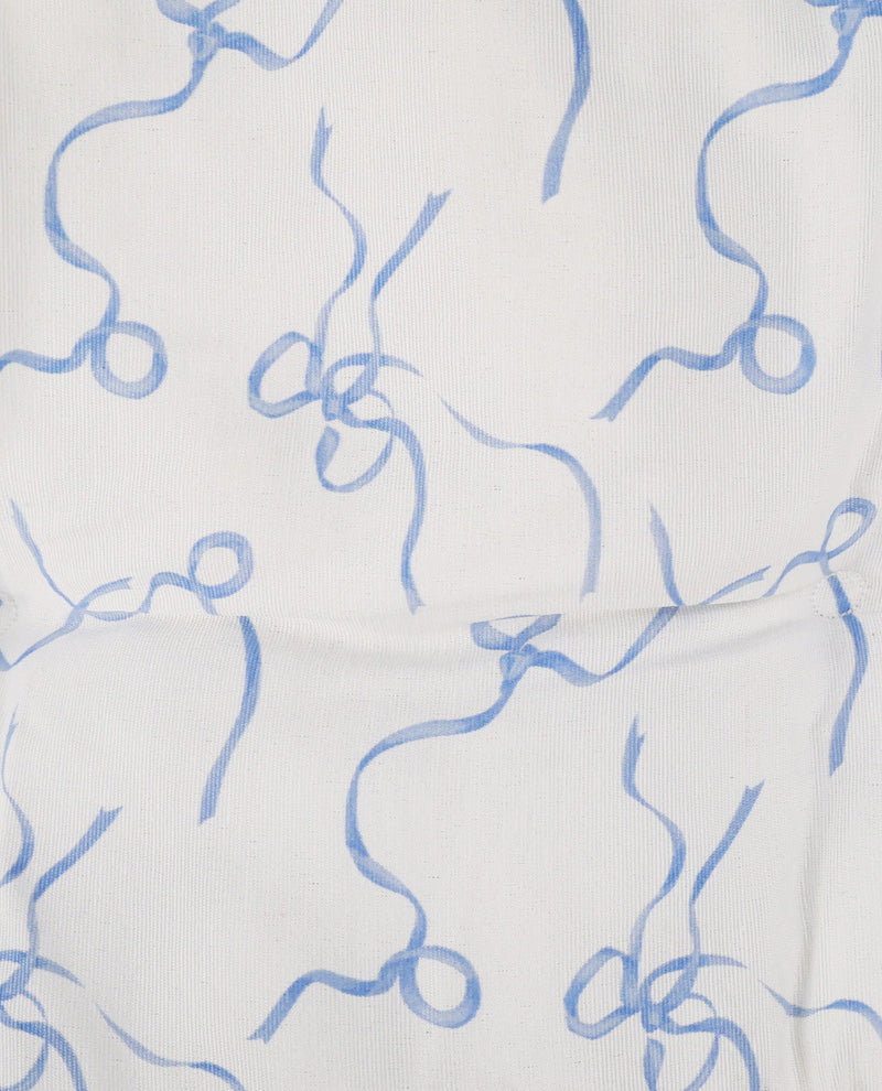 White fabric with a light blue abstract wavy line pattern.