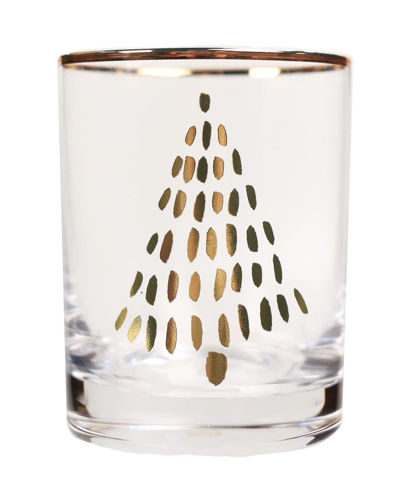 A clear glass tumbler with a metallic gold foil Christmas tree design on the front and a gold rim, shown against a plain white background.