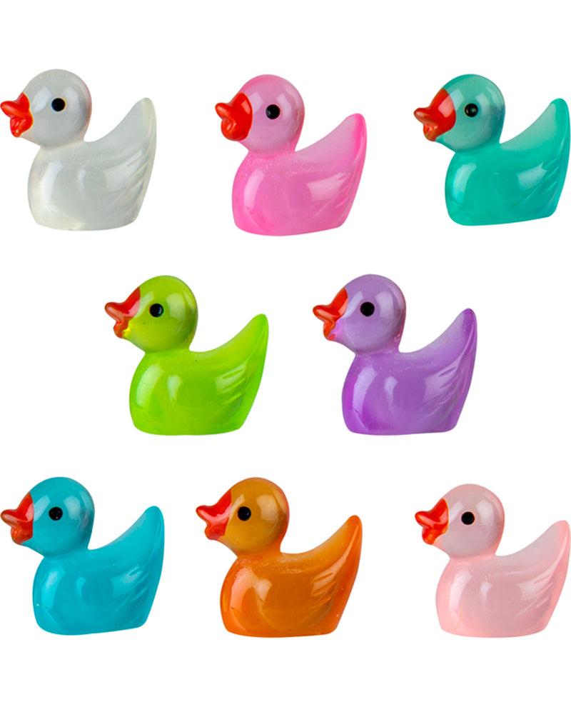 Set of colorful rubber duck toys on a white background