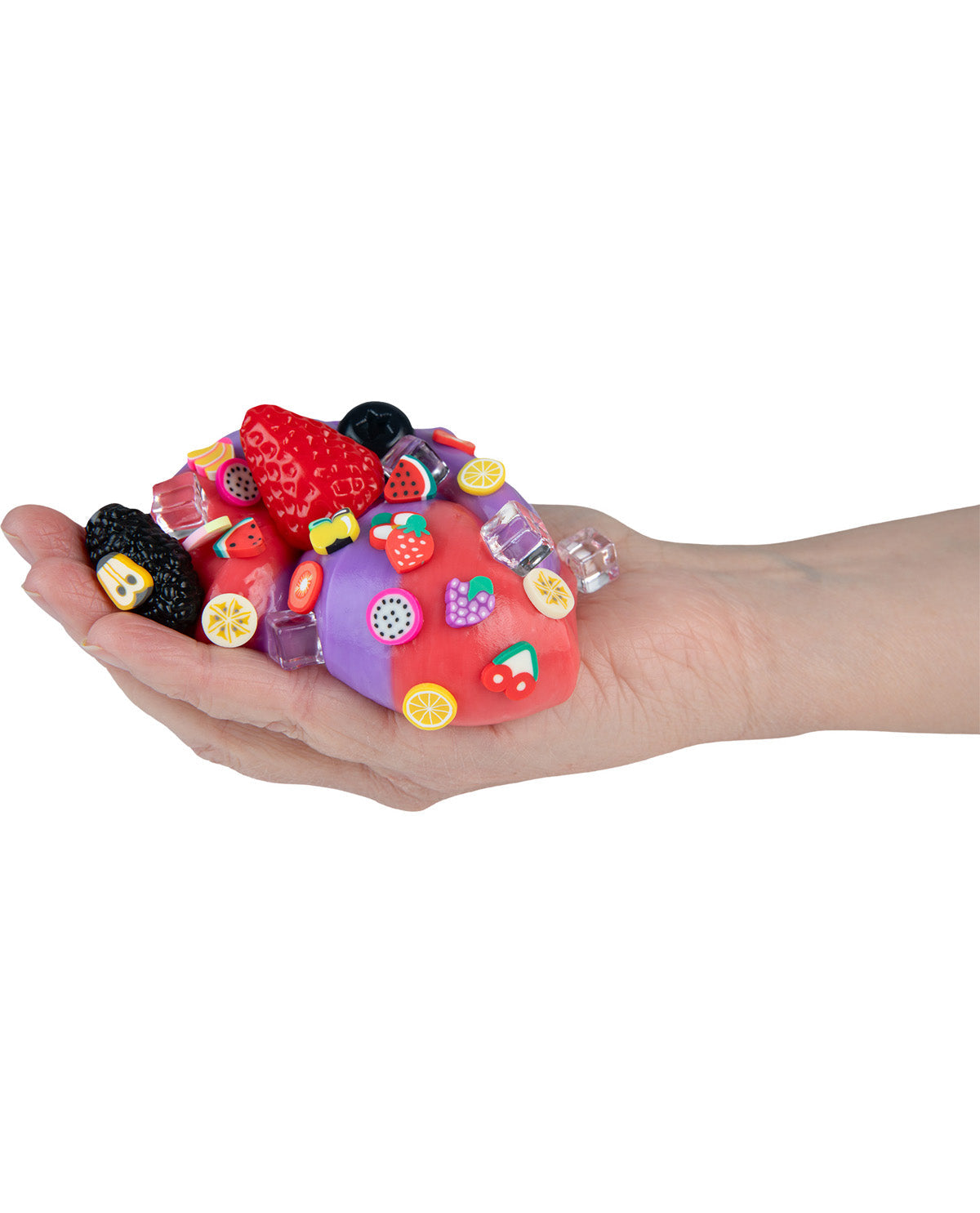 Colorful stress ball held in a hand on a white background
