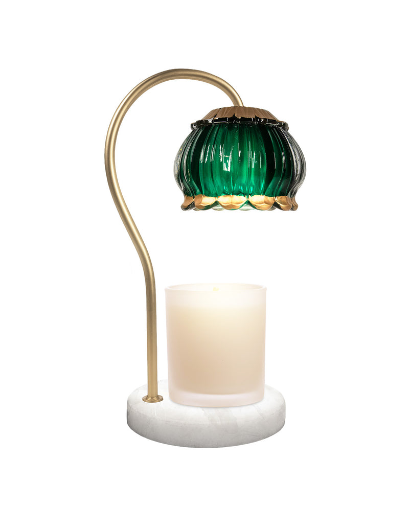 Decorative table lamp with green glass shade and gold accents on a white background