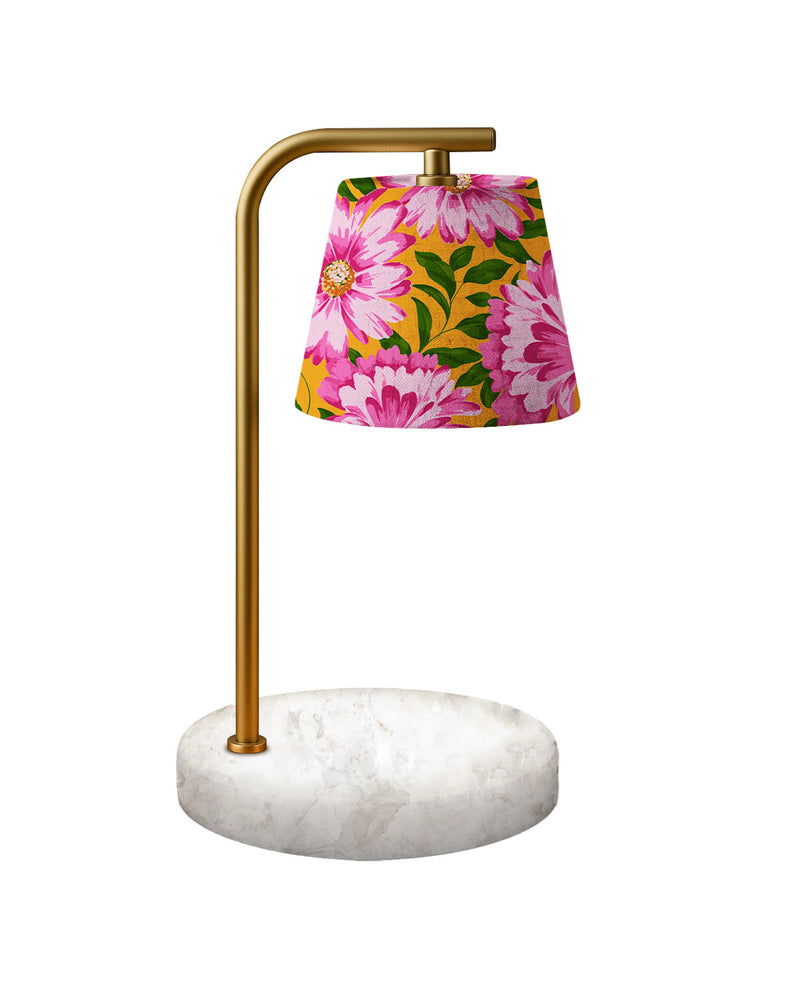 Table lamp with floral shade and marble base on a white background