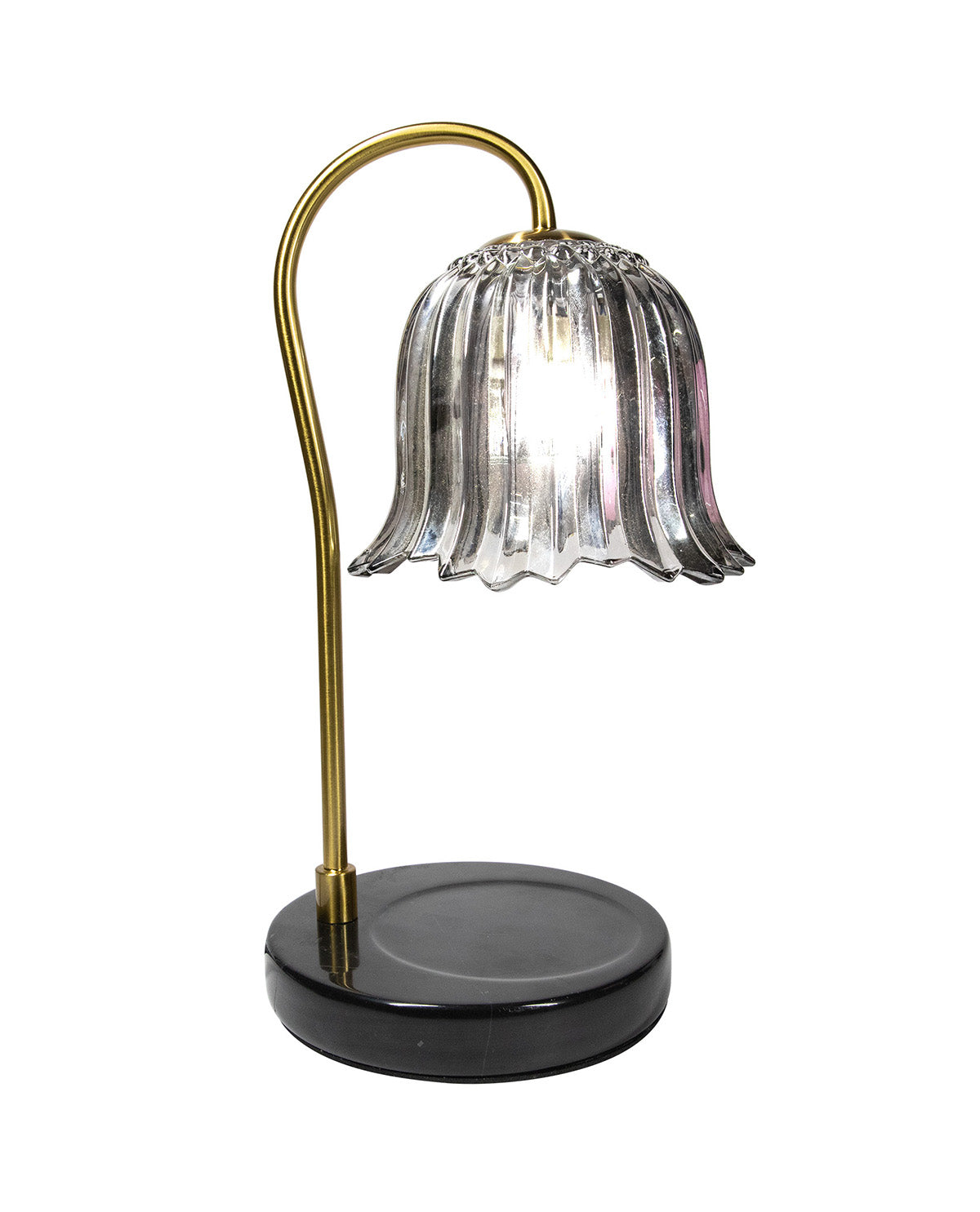Table lamp with a glass shade and brass arm on a white background