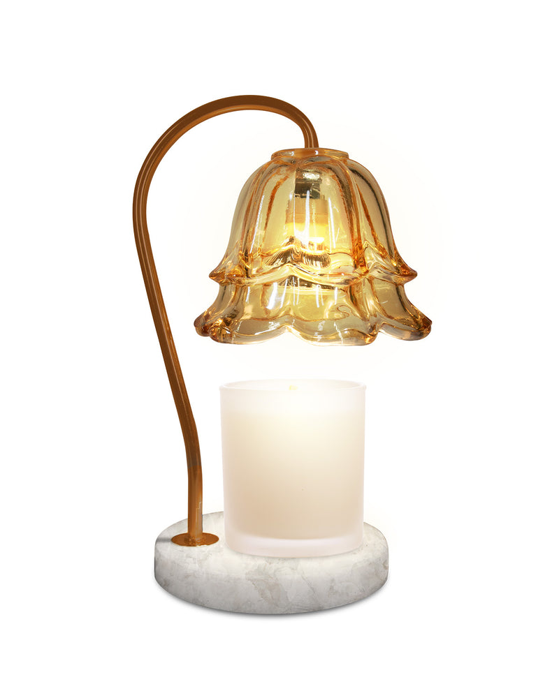 Decorative lamp with a glass shade and marble base on a white background