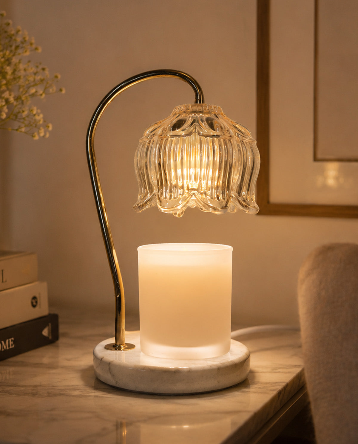 Decorative table lamp with glass shade and marble base on a surface.