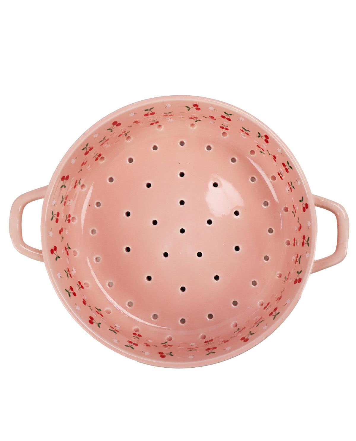 A pink ceramic colander with small red and green floral patterns around the rim, shown from a top-down view on a white background.