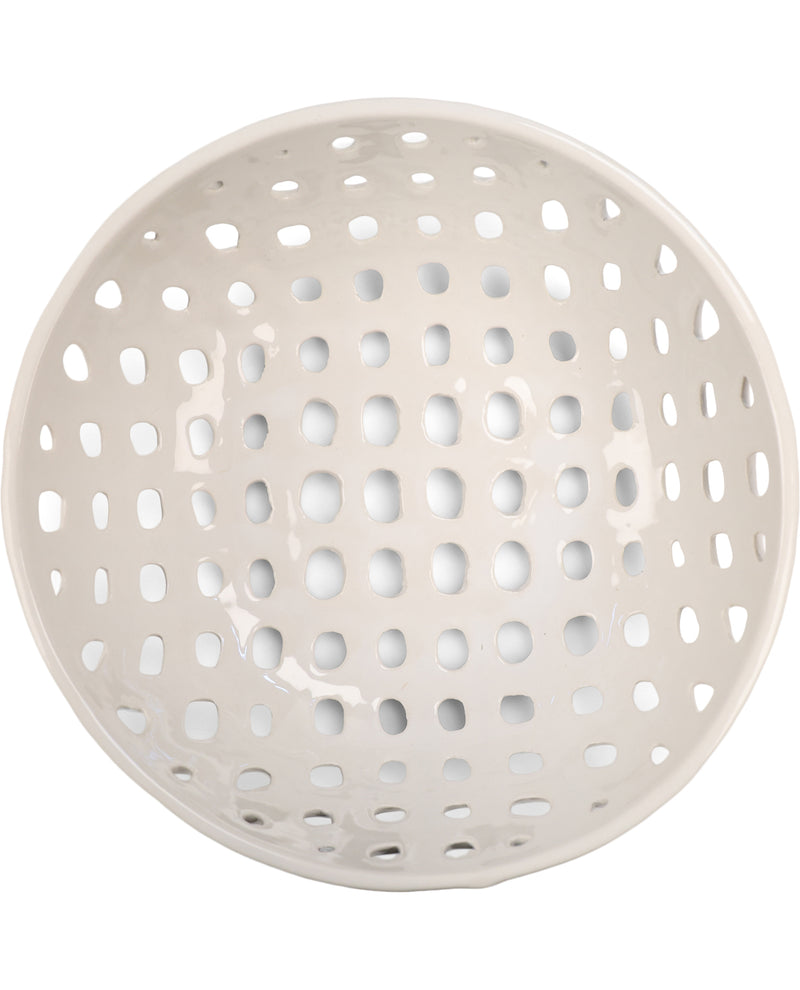 A round, glossy ceramic bowl with a perforated pattern of small oval holes, shown from a top-down view on a white background.