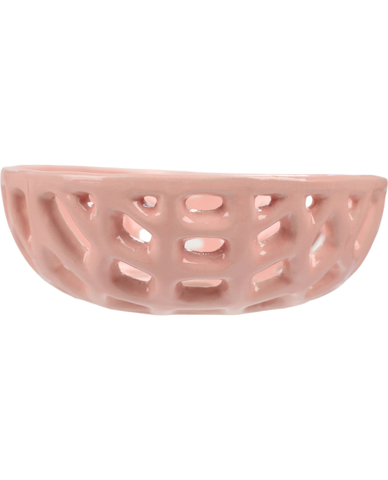 A small, semi-circular ceramic dish with an open lattice pattern, finished in a glossy light pink glaze, set against a plain white background.