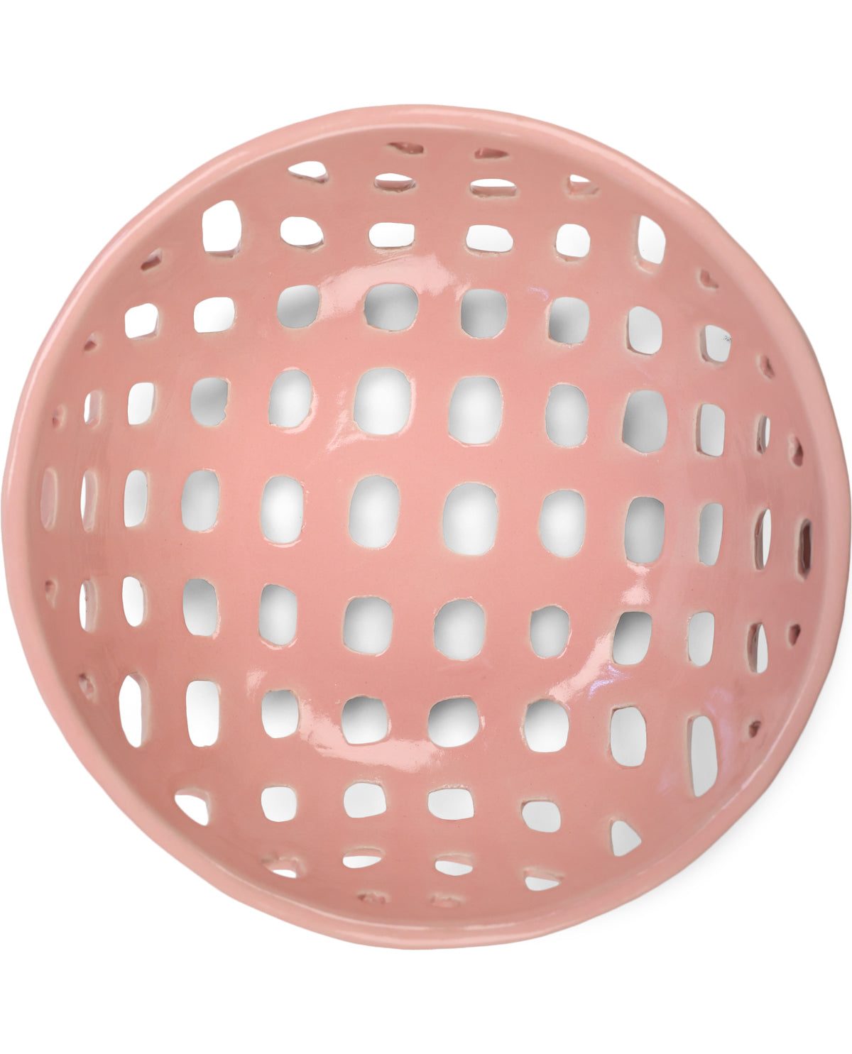 A glossy, round pink ceramic bowl with a perforated grid pattern, shown from a top-down view on a white background.