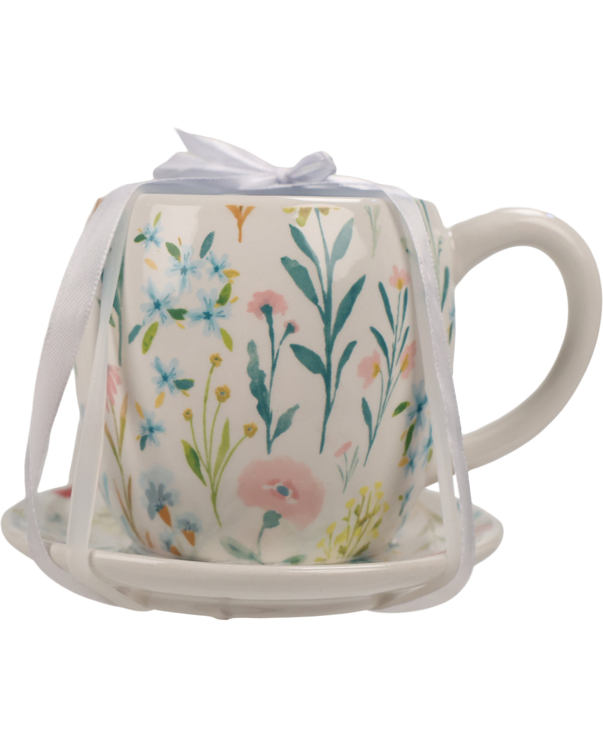 A ceramic teapot-shaped mug with a matching saucer, decorated with a pastel floral pattern. The mug is wrapped in a white ribbon and presented on a clean white background.