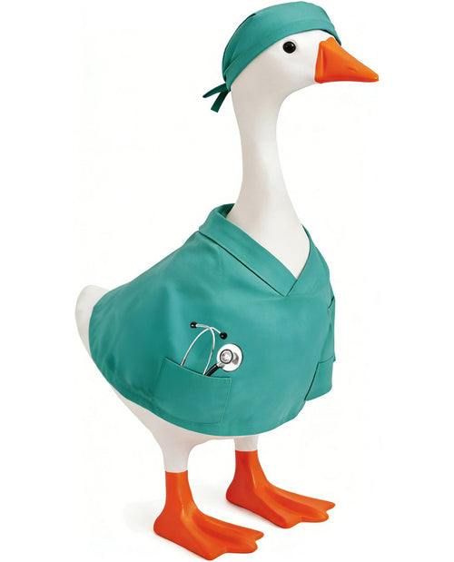 Duck toy dressed in a teal medical outfit with an orange beak and feet on a white background