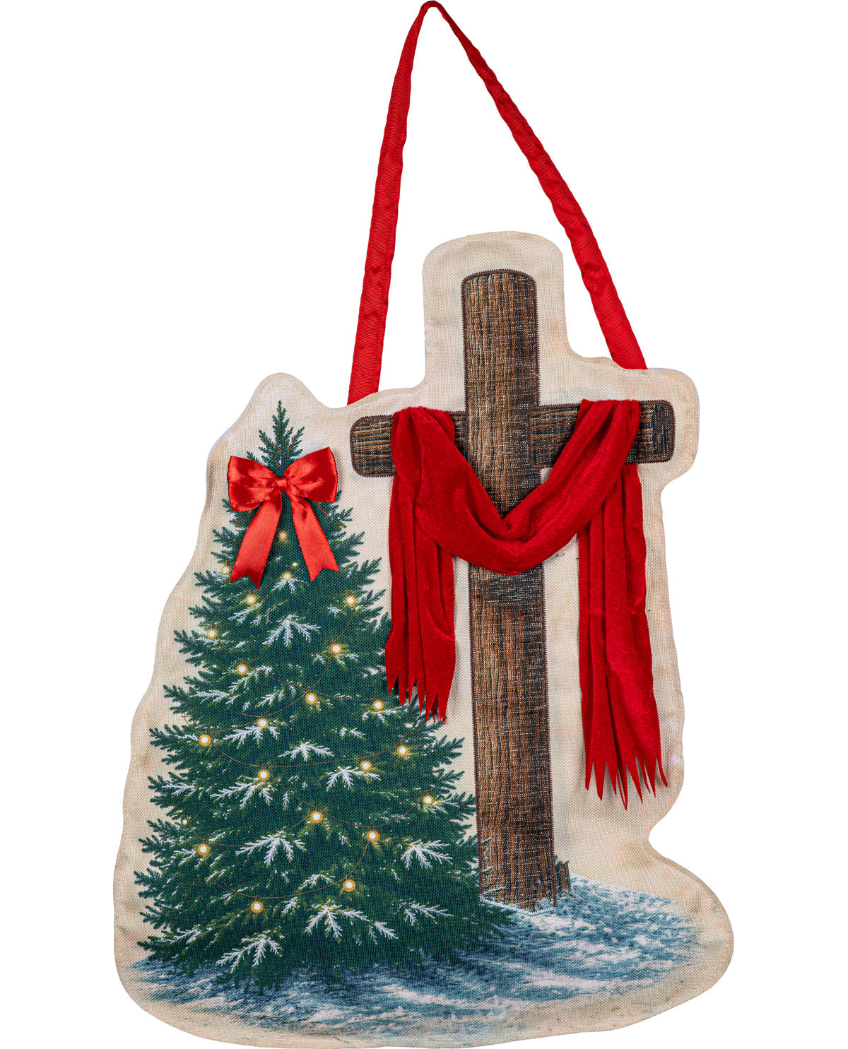 A Christmas-themed fabric wall hanging shaped like a cross, featuring a brown wooden cross draped with a red scarf, a green Christmas tree with lights and a red bow, and a red hanging ribbon, shown on a plain white background.