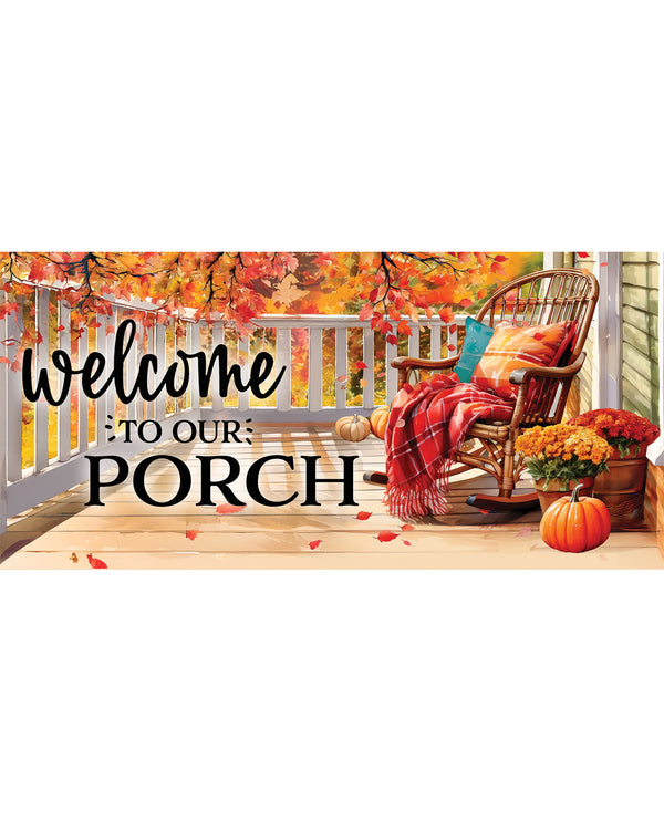 A rectangular decorative porch sign with the phrase 'Welcome to Our Porch' in black lettering, shown against a fall-themed porch scene with a rocking chair, plaid throw, pumpkins, flowers, and autumn leaves.
