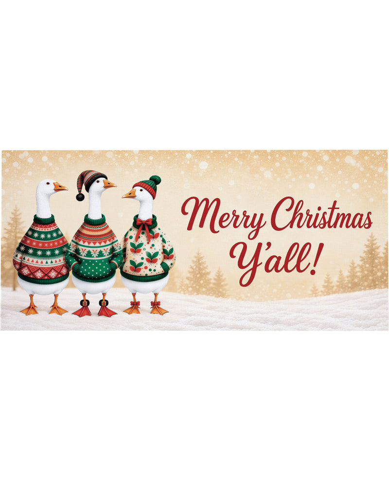 A festive Christmas greeting card design featuring three white decorative ducks wearing colorful knit sweaters and hats, standing in a snowy scene with the text 'Merry Christmas Y'all!' on a warm beige background.