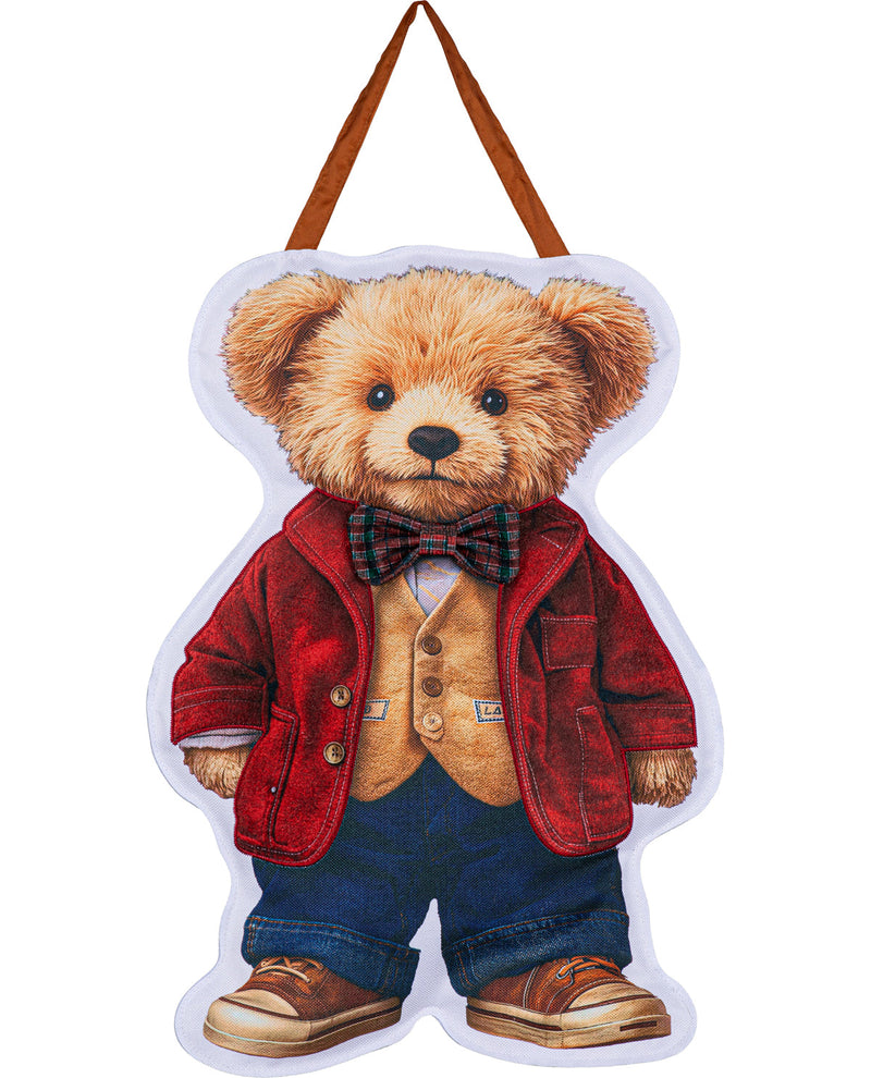A teddy bear-shaped hanging decoration wearing a red jacket, tan vest, blue pants, and brown shoes, with a brown hanging loop at the top, shown on a plain white background.