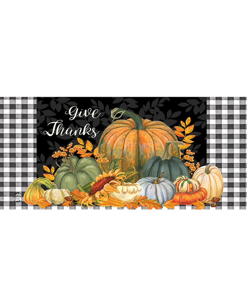 Decorative mat with pumpkins and leaves on a black background with 'Give Thanks' text, surrounded by plaid patterns.
