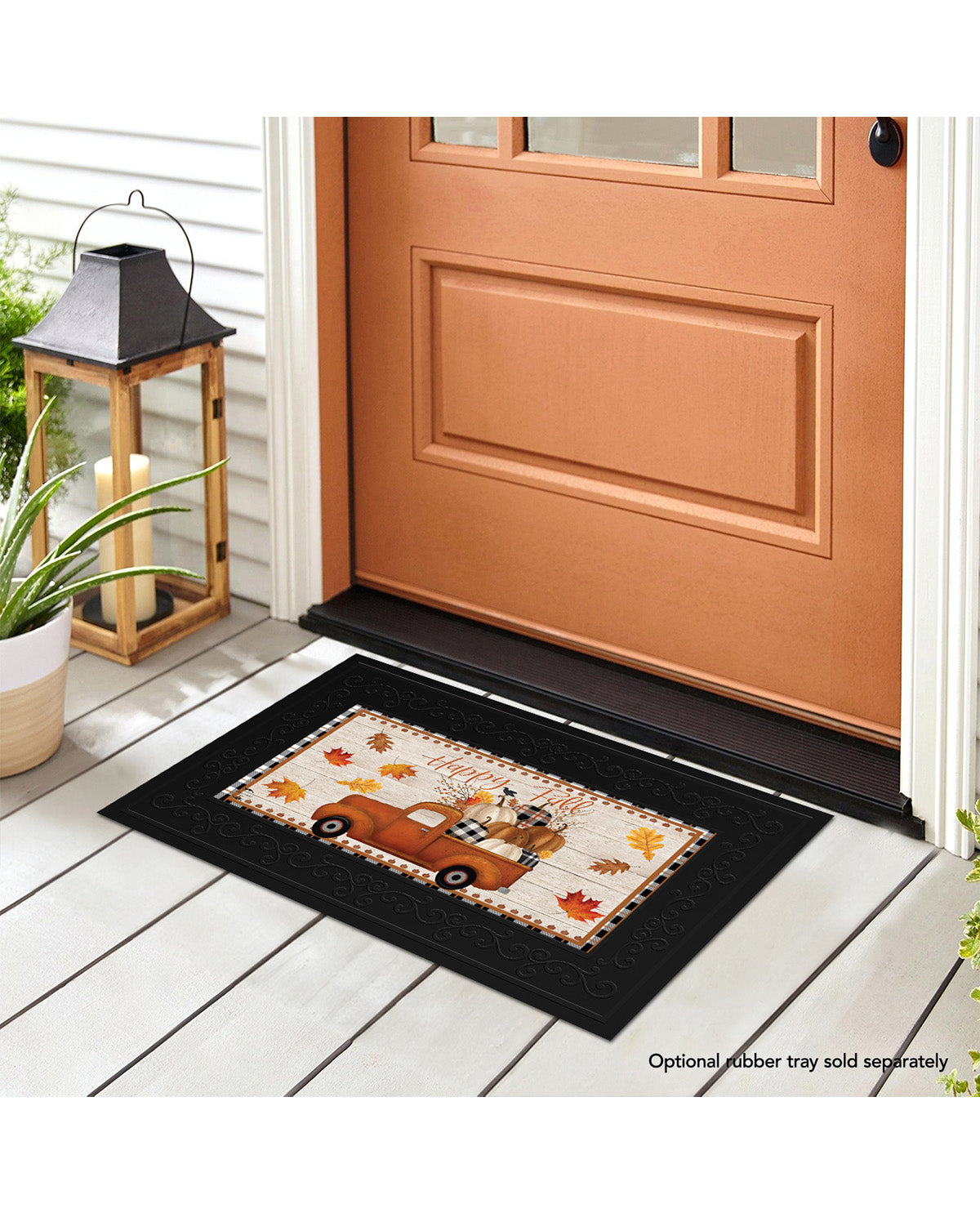 Decorative doormat with autumn design in front of a brown door.