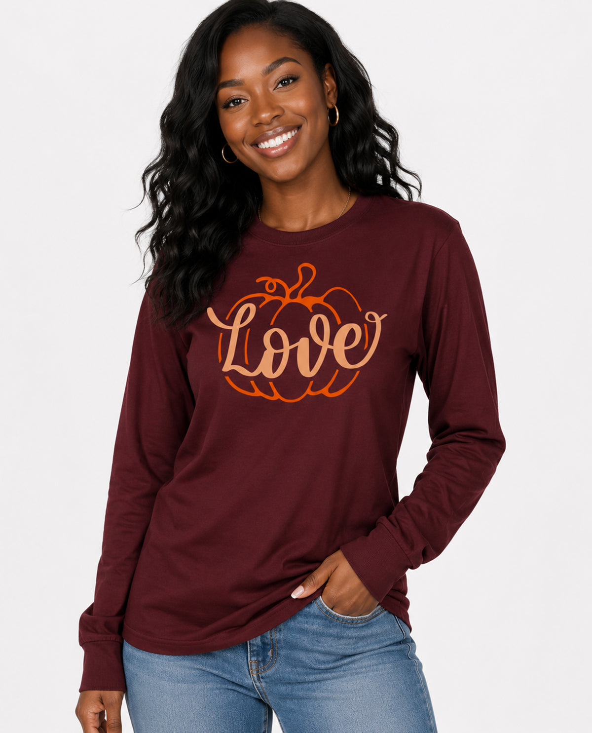 Woman wearing a burgundy long-sleeve shirt with 'Love' and pumpkin design on a white background