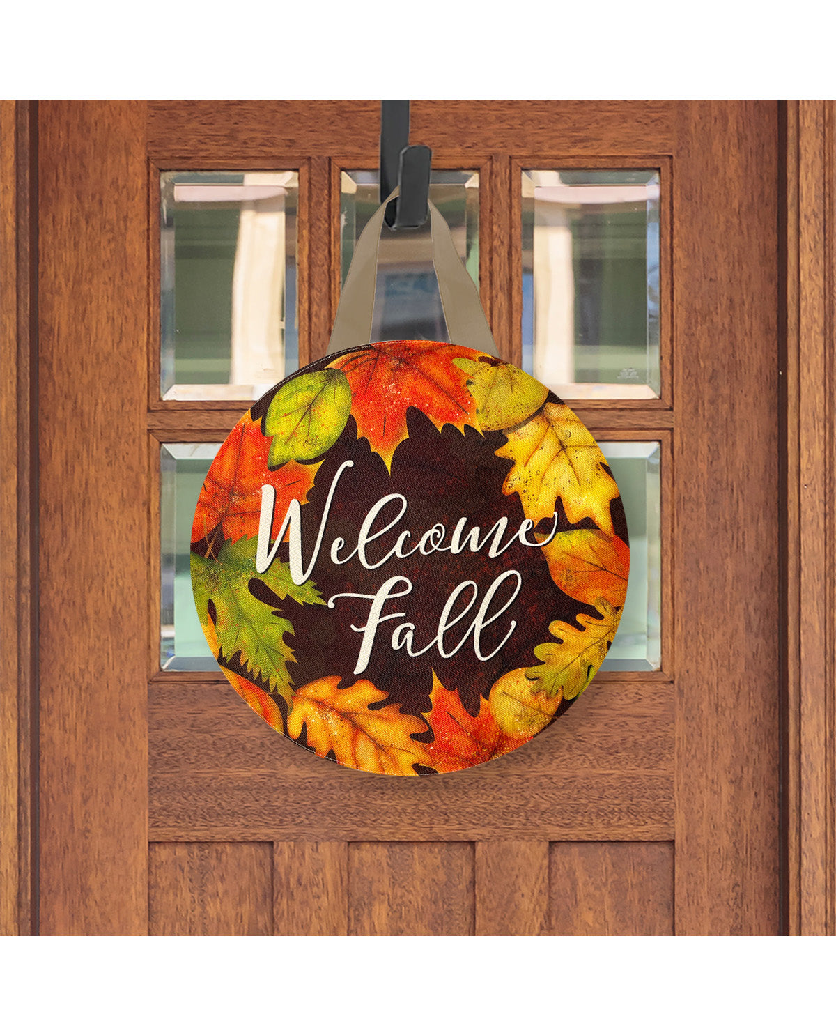 Decorative door hanger with autumn leaves and 'Welcome Fall' text on a wooden door.