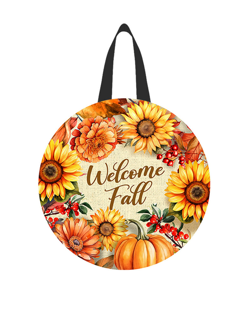 Round decorative item with sunflowers, pumpkins, and 'Welcome Fall' text on a white background