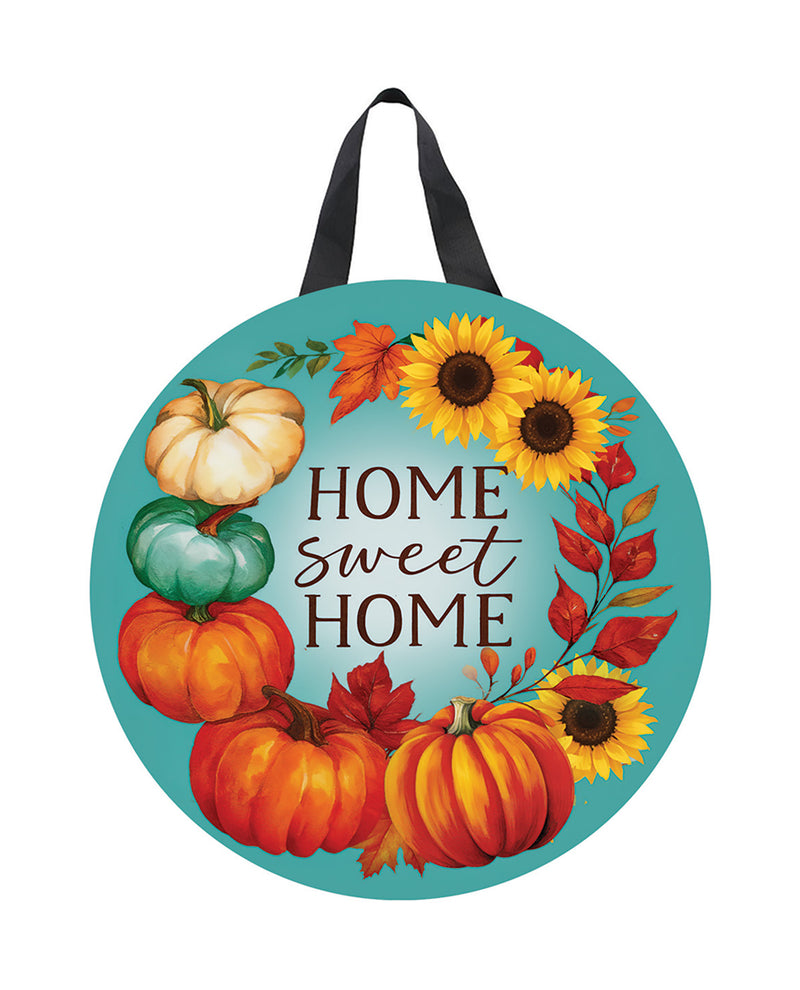 Decorative sign with pumpkins and sunflowers and 'Home Sweet Home' text on a blue background